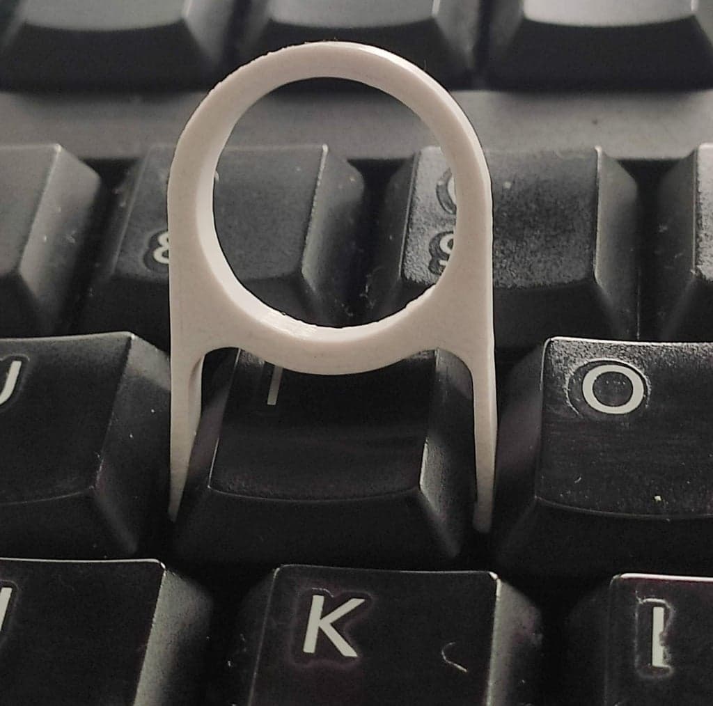 Устройство для снятия колпачков клавиатуры