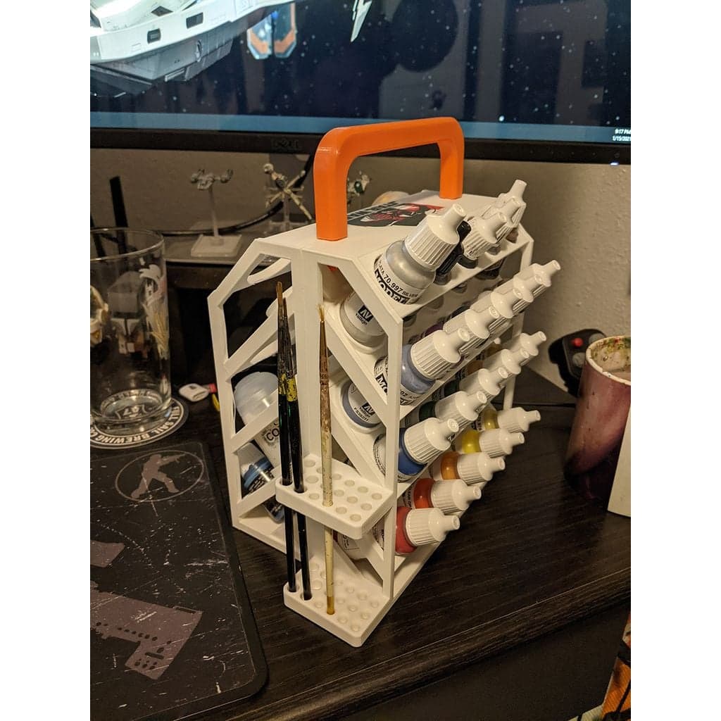 Двусторонний держатель для краски с ручкой.